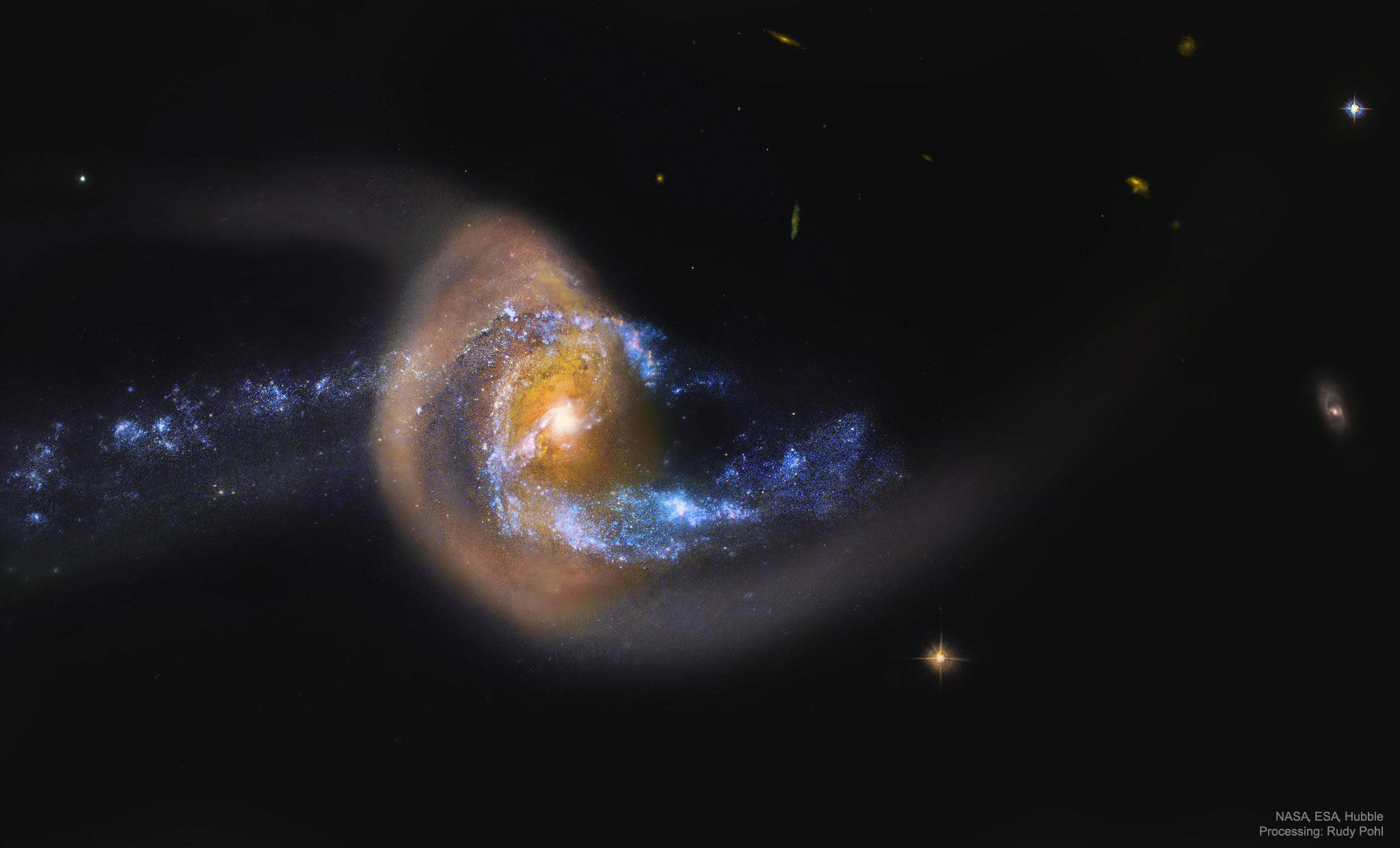 تبدو مجرّةٌ حلزونيّة زرقاء وكأنّها تتصادم مع -ورُبّما تعبر من خلال- مجرَّةٍ بُنّيّةٍ غبراء.
