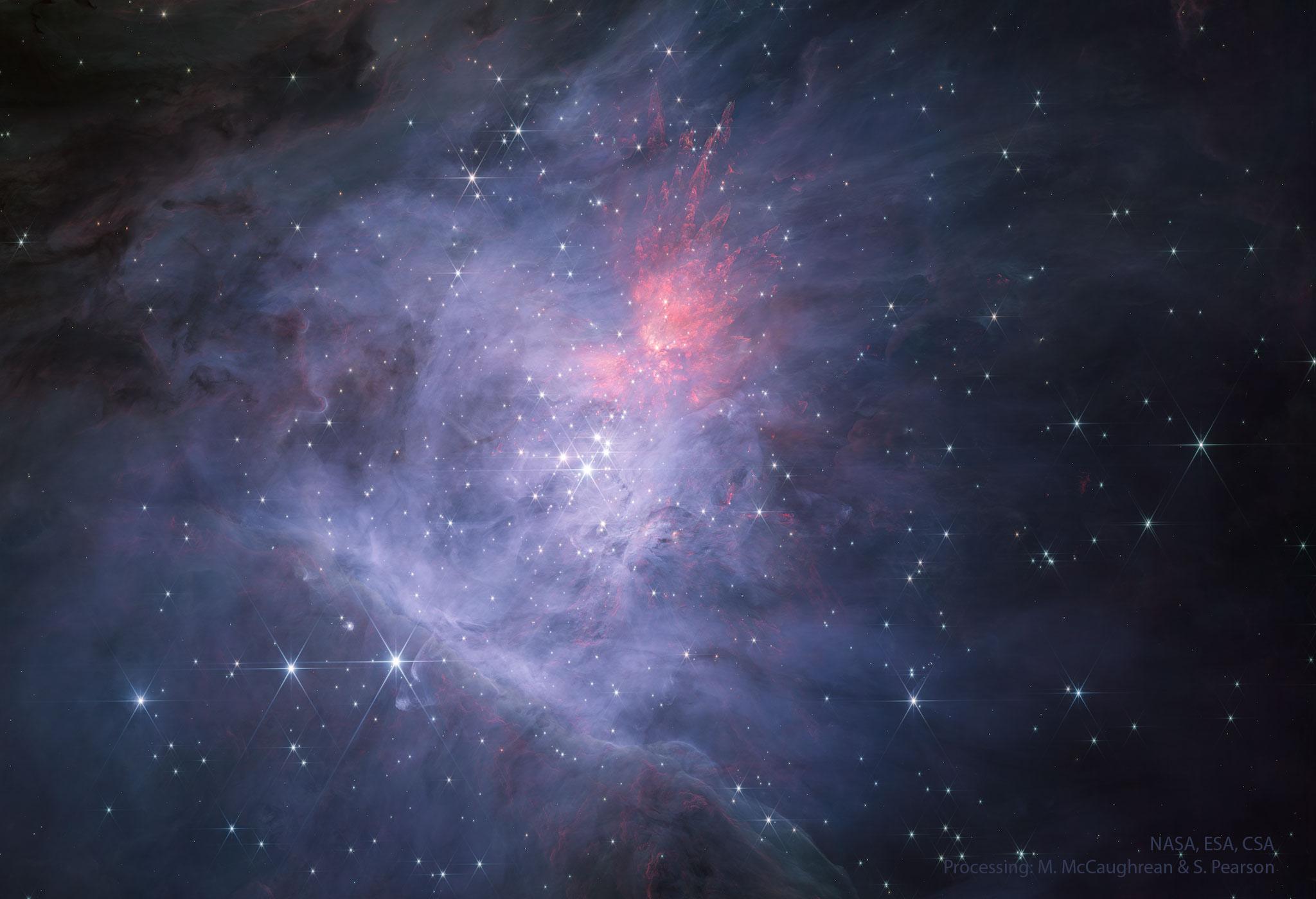 مركز سديم الجبّار في الضوء تحت الأحمر القريب كما صُوِّرَ بواسطة تلسكوب جيمس وِبّ الفضائيّ. في المركز يوجد عنقود نجوم المُعيَّن.